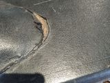 a close up of a piece of black leather on a table
