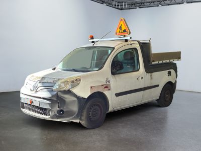 a white truck that has been vandalized in a garage