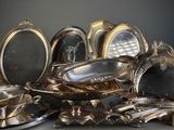 a lot of silver dishes on the table