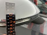 a measuring tape on the side of a car
