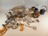 a lot of silver and silverware on a table