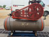 a large air compressor sitting on top of a pallet