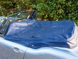 a car with a blue cover on top of it