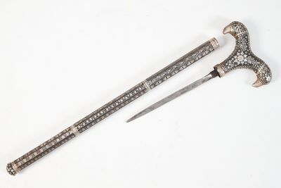 an image of a pair of swords on a white surface
