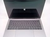 a close up of a laptop computer on a white surface