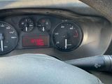 steering wheel of a car with a digital display on the dashboard