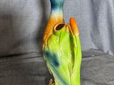 a figurine of a bird sitting on a table