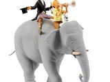 a figurine of a man riding on top of an elephant