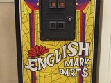 a machine that is sitting on the floor in front of a wall