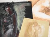 a drawing of a nude woman next to a drawing of a woman