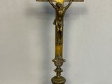 a cross on a stand with a crucif on it
