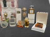 a lot of perfume bottles and boxes on the table