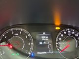 a close up of the dashboard of a car with the lights on