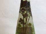 a glass vase with a picture of a tree on it