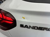 the rear end of a white car with the word sandero on it