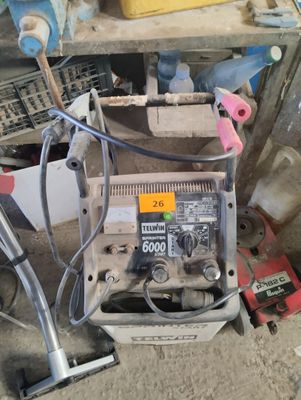 a machine that is sitting on the ground in the garage