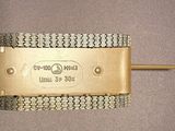 a gold metal belt with a chain around it