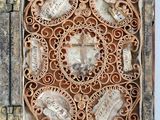 an old wooden box with a decorative design on the inside of it
