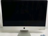 a computer monitor sitting on top of a white table