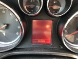 a close up of a car dashboard with various gauges