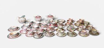 a lot of small plates and bowls sitting on a table
