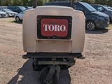 a small machine that is parked in a parking lot