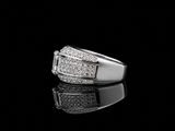 an image of a ring with diamonds on a black surface