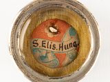 a picture of a button with the name ellis hung on it