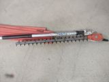 two tools that are laying on the floor