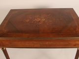 a small wooden table with a drawer on top of it