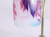 a lamp that has a glass shade on it