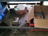 a pile of boxes on a conveyor belt in a warehouse