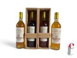 three bottles of wine in a wooden box on a white background