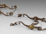 pair of antique brass plated horse bittles with chain