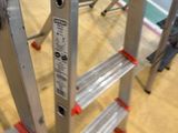 a ladder that is sitting on the floor in a room