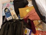 a suitcase full of clothes and other items in it