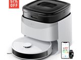 an image of a white and black coffee maker with a remote control