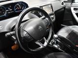 the interior of a car with a steering wheel and dashboard controls