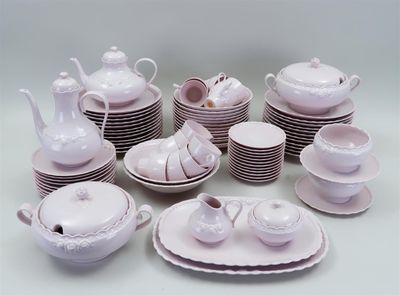 a lot of white dishes and cups on the table