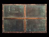 an old window that has been painted green and brown
