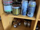 a wooden shelf filled with cans and jars of food