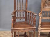 pair of antique oak rocking chairs with carved back and arms