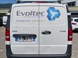 a white van that is parked in a parking lot