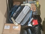 a cardboard box filled with assorted items in a room