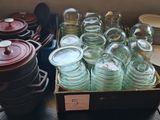 many jars and pans sitting on a table