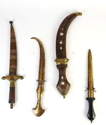 several different types of knives are displayed on a white surface