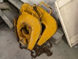 a yellow bulldozer sitting next to a pile of junk
