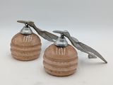 two salt and pepper shakers sitting on a table