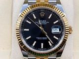 Montre Rolex à cadran noir et bracelet bicolore en or
