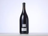 a bottle of wine that is sitting on a table